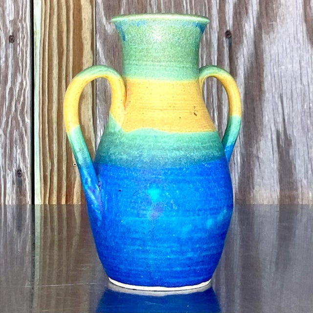 A striking vintage studio pottery vase. Beautiful colors dominate this simple composition. Signed by the artist. Acquired...