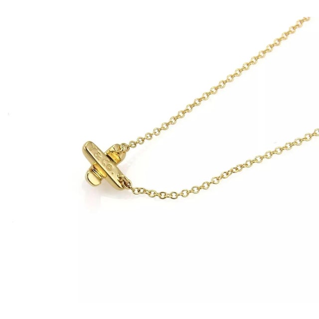 Contemporary Tiffany & Co. Stitch Crossover 18k Yellow Gold Pendant Necklace For Sale - Image 3 of 6