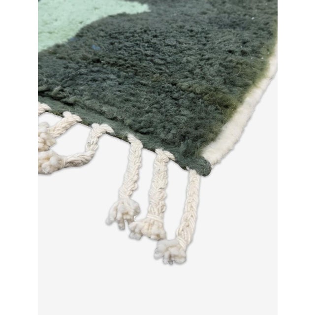 Boujad Rug | Handwoven Berber Wool Rug with Green Camouflage Abstract Design This striking Boujad rug features a deep...