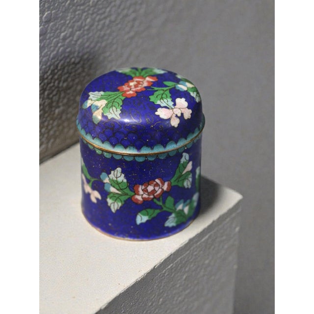 This Vintage Asian Cobalt Blue Floral Cloisonné Covered Jar originates from China, showcasing intricate Chinese culture...