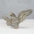 An elegant carved wooden sculpture depicting an eagle with outstretched wings, a distinctive emblem of the napoleonic era....