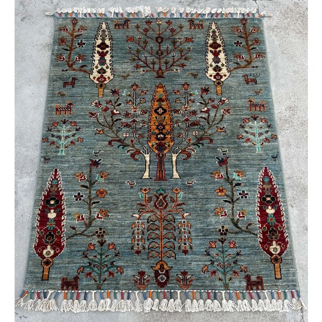 DESCRIPTION: This small Persian Tree of Life rug is a hand-knotted wool treasure, rich in symbolism and visual depth....