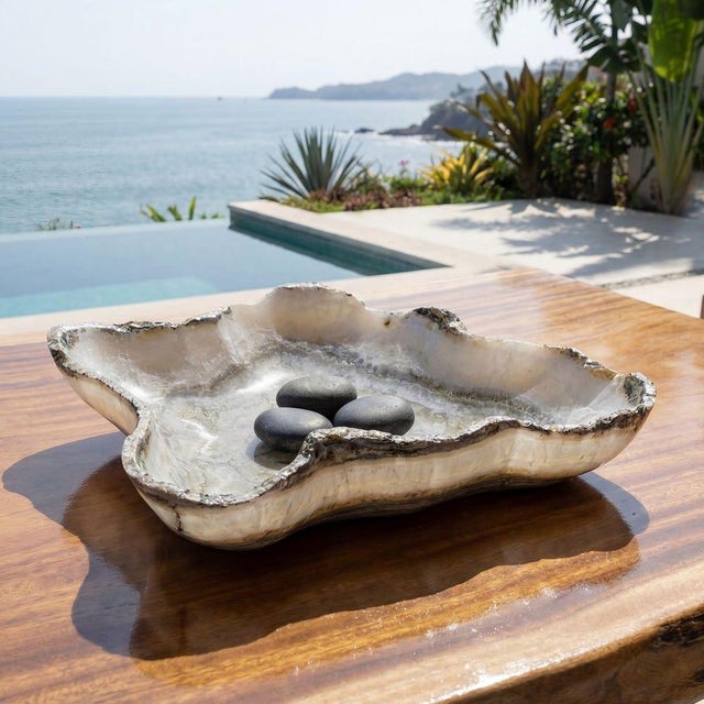 Hand-carved from natural ivory and gray onyx stone.Beautiful organic-shaped bowl showcases raw, earthy beauty with its...