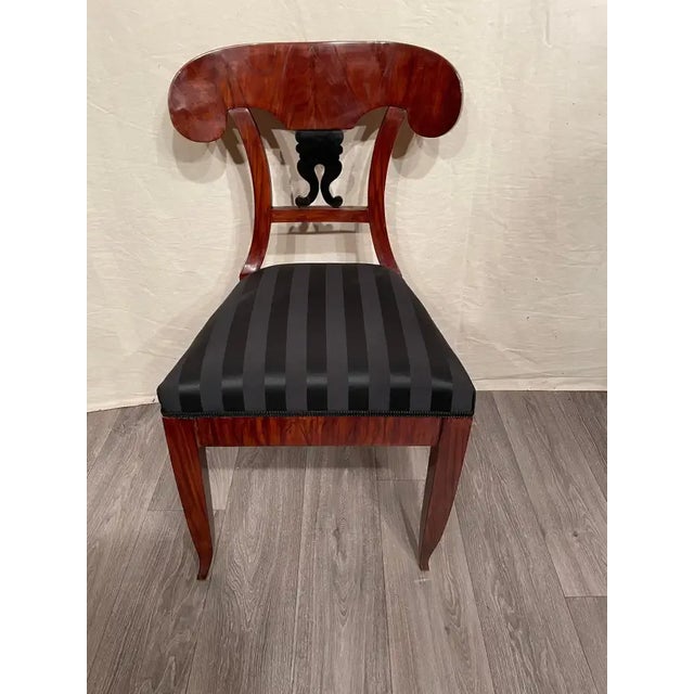 Biedermeier Chair, South German 1820. Beautiful walnut veneer embellishes this original Biedermeier chair. The back is...