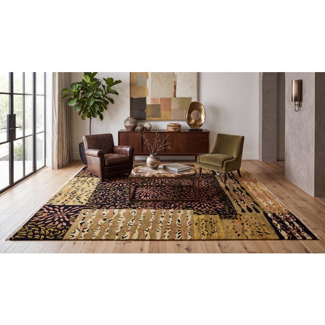 Elevate luxury interiors with this contemporary hand-knotted wool area rug, featuring an expressive blend of modern...