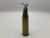 A cool vintage bullet shell that has been turned into a two-way bottle opener. The center is filled with what looks like...