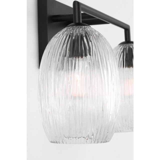 Serafina 16-inch Vanity by Hable offers a sculptural approach to functional lighting, with softly contoured glass pods...