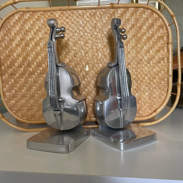 Vintage Bass Cello Violin Bookends, Polished Aluminum , Excellent Condition Measurements: 10.25" tall, 4" x4" base