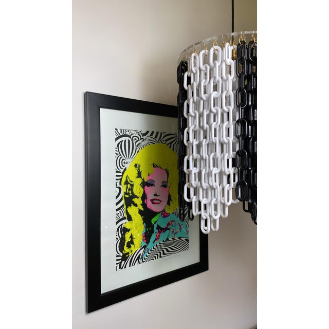 One of a kind light fixture created by Junk is the new black. Suspended by a black cord attached to a 12” round lucite...