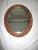 This is a Superb! Vintage Ornate Carved Wood and Gesso Oval Frame with Mirror with a Gold Finish that is 34" x 28" with a...