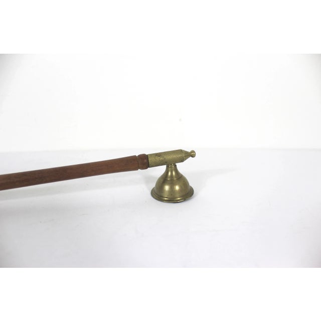 Very long handled solid brass candle snuffer with nice vintage patina and a long wood handle and a match striker. Perfect...