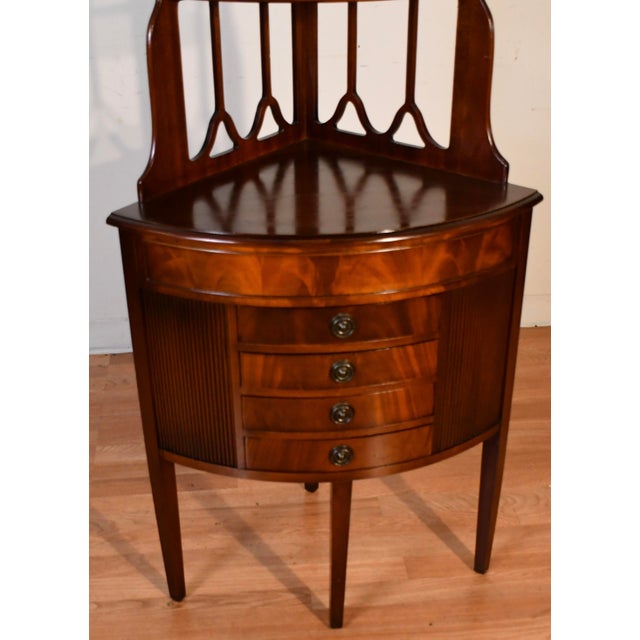 We are pleased to offer this beautiful English Regency corner Etagere, from the 1940s. This piece is made of Mahogany...