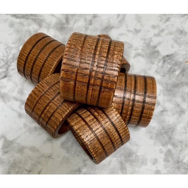 Vintage solid wood napkin rings with textured pattern and rustic Americana design. Set of six.