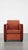 Luxurious Art Deco design armchair with red fabric upholstery and wooden details. This sleek and luxurious armchair is a...
