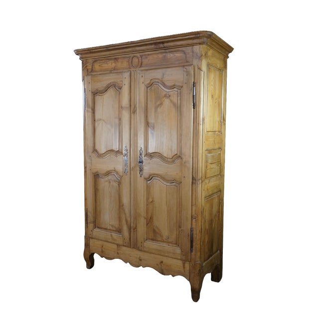 This magnificent antique French provincial country pine armoire showcases the timeless rustic elegance of traditional...