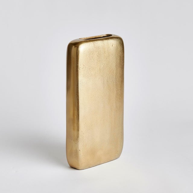 Designed with a shallow profile, this simple vase is perfect for narrow shelving and alcoves. Small in scale, it is ideal...