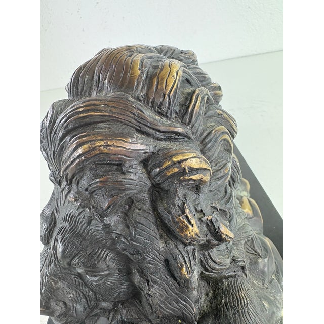 This is a mid 20th century grand tour, Italian lion sculpture. This lion sculpture has a beautiful dark olive green age-...
