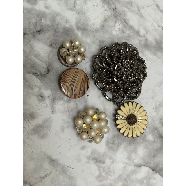Vintage set of five upcycled vintage jewelry pieces converted to magnets. Eclectic pearls and beaded clusters add a little...
