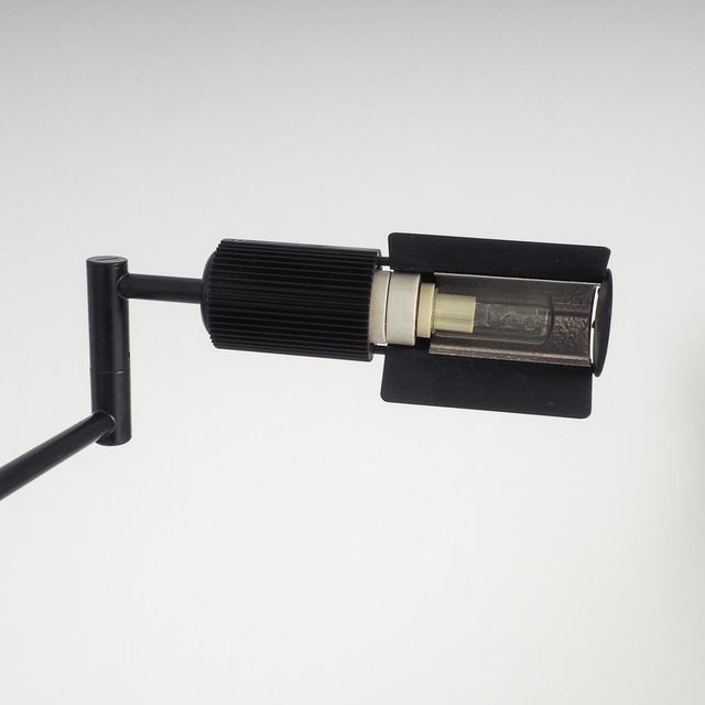 The haloprofil 878hr floor lamp in matte black bring a piece of swiss precision and 1970s architectural flair into your...