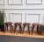 Beautiful set of 4 antique Italian solid walnut side tables or stools with squared and beveled seat or top standing on...