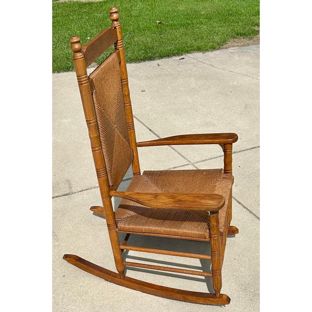Mid-Century Modern Extra Large Adult, Rush-Woven Seat and Backrest, Solid Oak, Turned Legs and Spindles, Wide Arm Rests, 1960’s, For Sale - Image 3 of 6