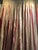 A pair of lined and pleated silk taffeta curtains in red, yellow, and ivory from the Silk Trading Company. The pleats and...