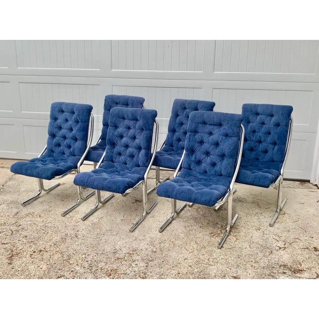 Elevate your dining space with this striking set of six (6) mid-century modern cantilever chairs manufactured by Daystrom....