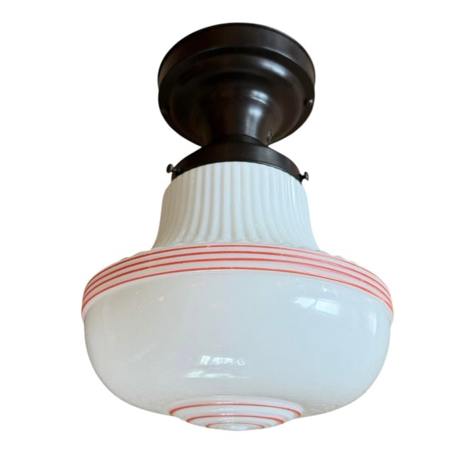 A classic milk glass light fixture from the 1930’s perfect for a kitchen, bathroom or hallway. Add a pop of retro charm to...