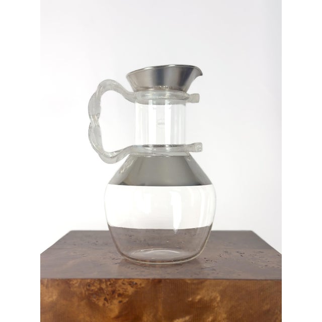 This Dorothy Thorpe carafe is not only a functional piece for serving beverages, but it’s also a beautiful decorative item...