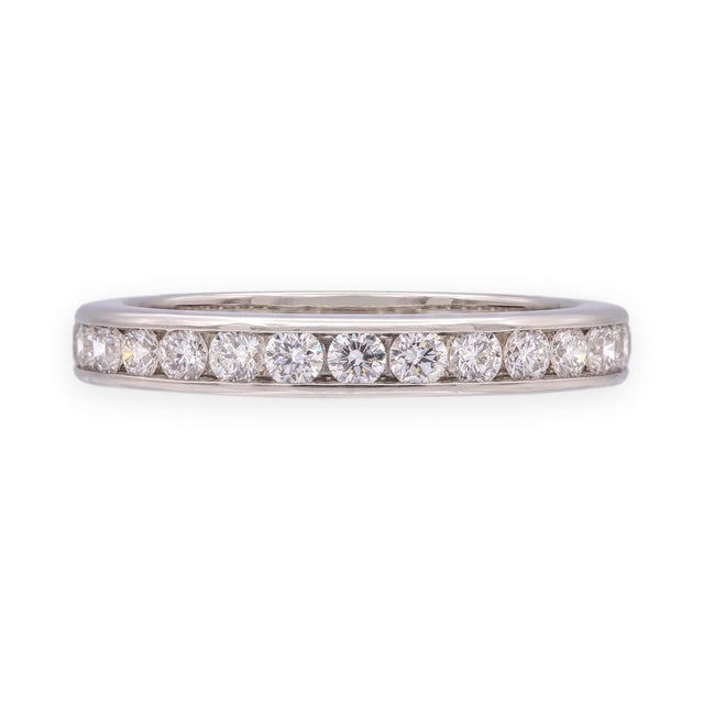 A full eternity band in platinum with 28 round brilliant channel-set diamonds. Diamonds total 0.84ct, graded F in color...