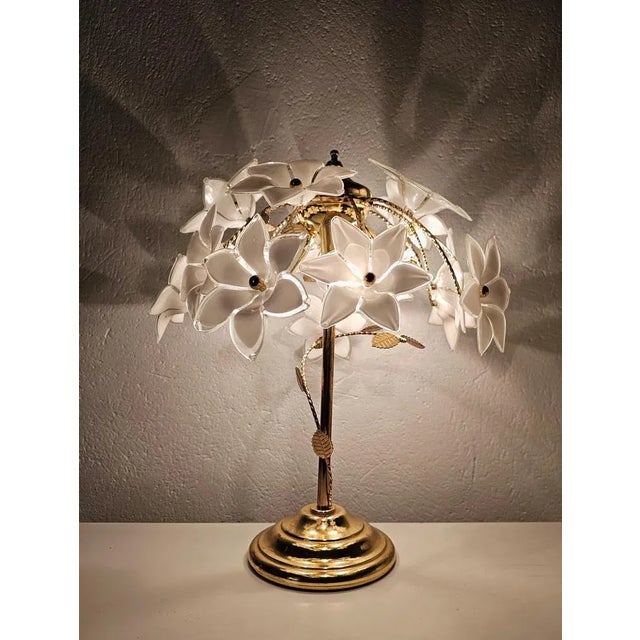 This listing features a beautiful, mid century modern table lamp, which was made in Murano, Italy. It consists of the...