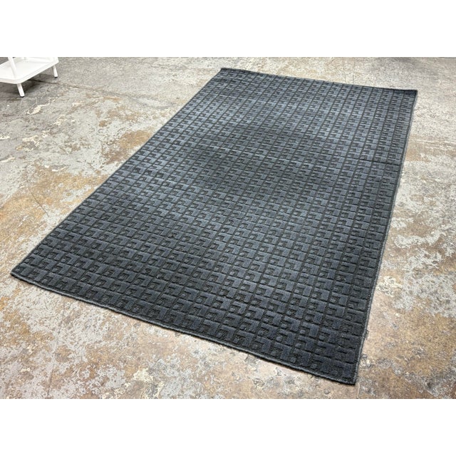 Design Plus Gallery presents the 5ft x 8ft Modo Ink Wool Rug from Room & Board. This wool rug has a tonal geometric...