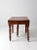 An antique oak drop-leaf dining table with a beautifully traditional silhouette. Five turned legs on casters support the...
