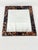 Fabulous vintage faux tortoise mirror. Made of wood. Wired to hang on the back, but can also be used with a stand. Makes a...
