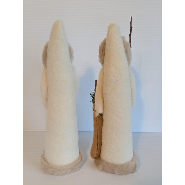 A sweet pair of hand crafted Folk art Victorian style felted wool and faux fur Santas, stuffed with cotton fabric which...