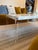 Acrylic legs and a beige crystal stone top make this a true statement piece for your sitting area. 48"L X 27"W X 19"H