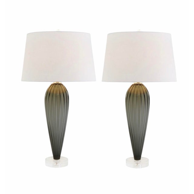 New in box pair of Global Views Teardrop Glass Table Lamps in grey. These elegant lamps feature a sculptural ribbed glass...