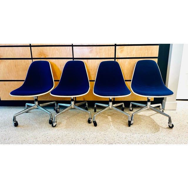 Hard to find four-piece set of 1960's fiberglass swivel chairs designed by Charles and Ray Eames for Herman Miller. The...
