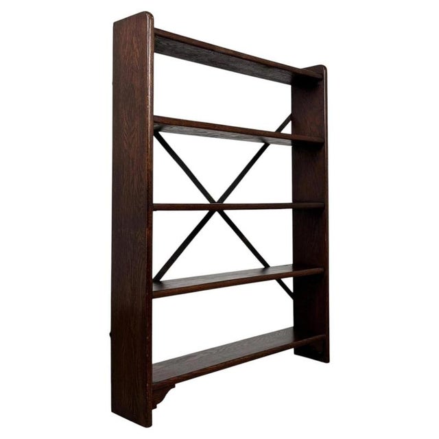 A distinctive and characterful 20th-century industrial style open bookcase in oak, combining the natural warmth and...
