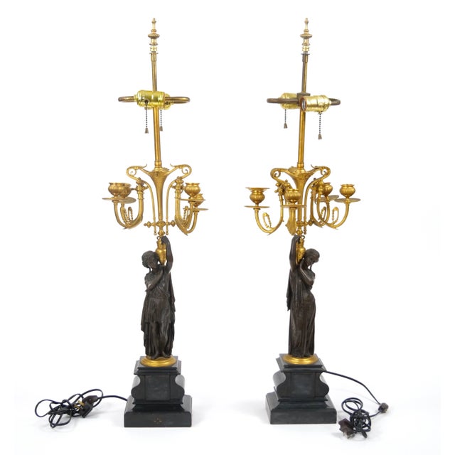 These stunning 19th-century French Napoleon III-style gilt bronze candelabra table lamps capture the opulence and artistry...