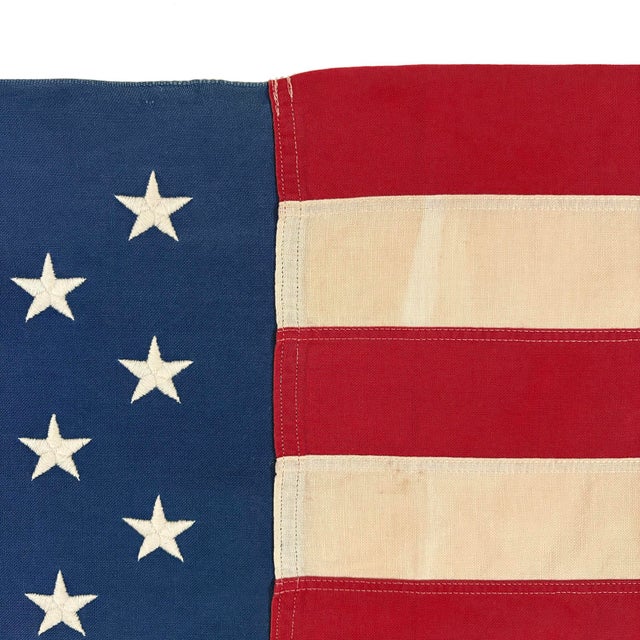 This vintage American flag is made from a cotton cloth with fully sewn stripes and 50 embroidered stars. Please note...