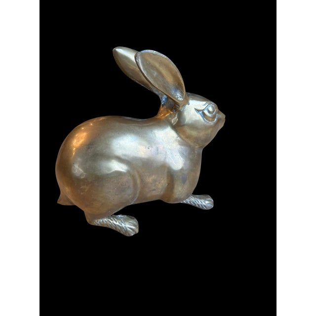 Offering a vintage solid brass heavy, large rabbit with an aged patina finish. Timeless vintage decor for modern or rustic...