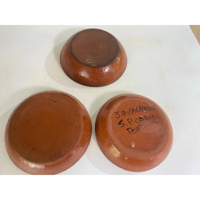 Yellow Brown Blue\. plates in Faience. It has been made in Portugal in the 20th century. It is hand painted. with Flowers...