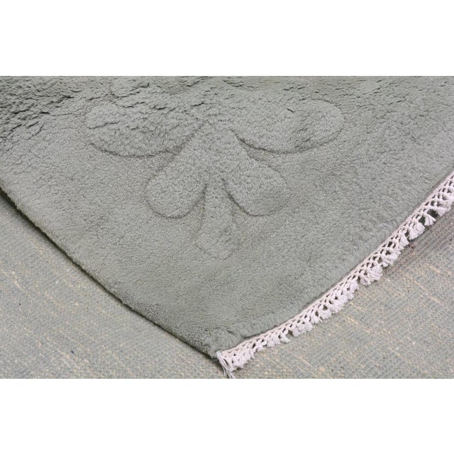 Hand-knotted with care using traditional rug-making techniques, this wool rug blends timeless craftsmanship with a modern...