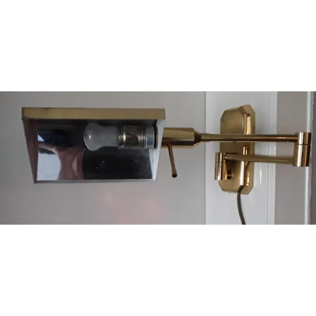 Vintage Adjustable Gold Colored Sconce, in Good conditions. Designed 1970 to 1979 European Plug (up to 250V).The wiring of...