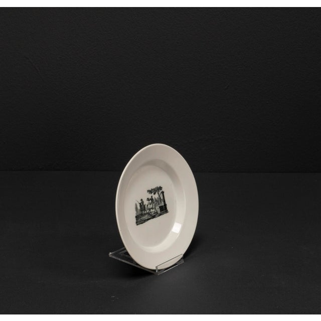 An impressive porcelain plate from the renowned german manufacturer kpm, dating back to 1810 h., featuring a striking...