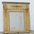 A petite 19th century French trumeau mirror that is relatively compact in its proportions yet sophisticated in the...