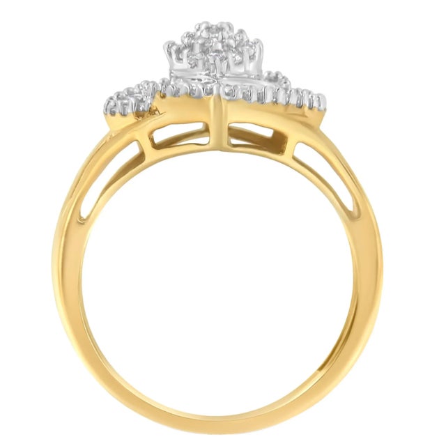 A diamond cocktail ring that sparkles with a central marquise-shaped cluster of round brilliant cut diamonds surrounded by...