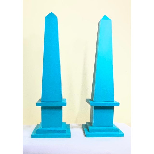 Enhance your interior decor with this striking, hand-painted pair of solid wood decorative obelisks. Melding classic...