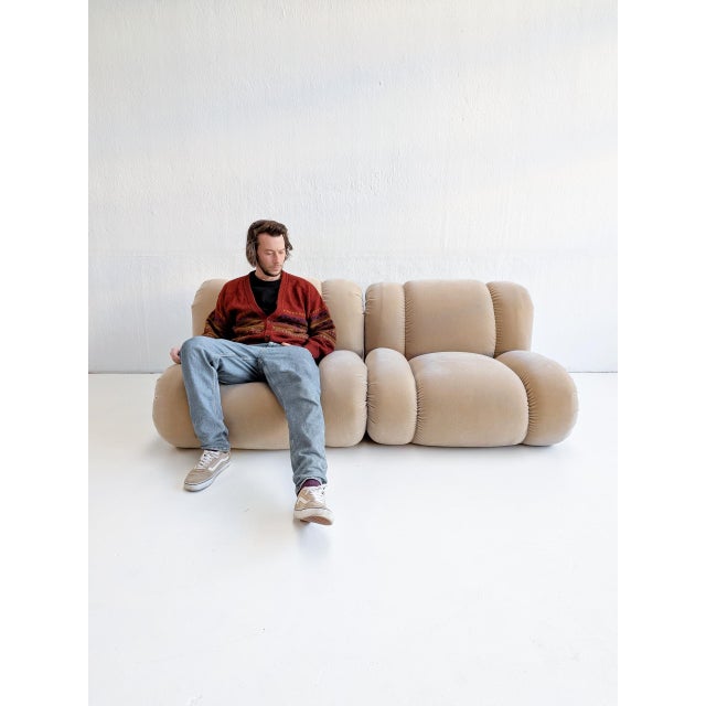 Set of two 1970s 'Velasquez' lounge chairs in beige velvet, created by Italian designer Rino Maturi for Mimo Padova. The...